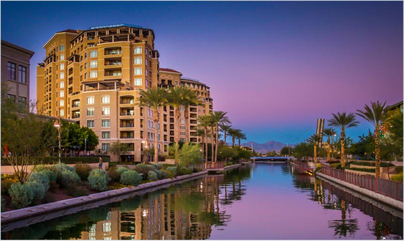 luxury high-rise apartment community at sunset