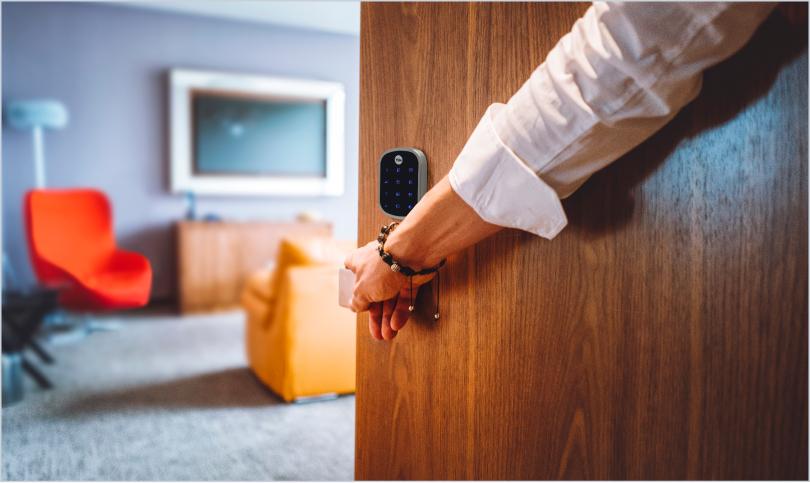 person opening door to aparment