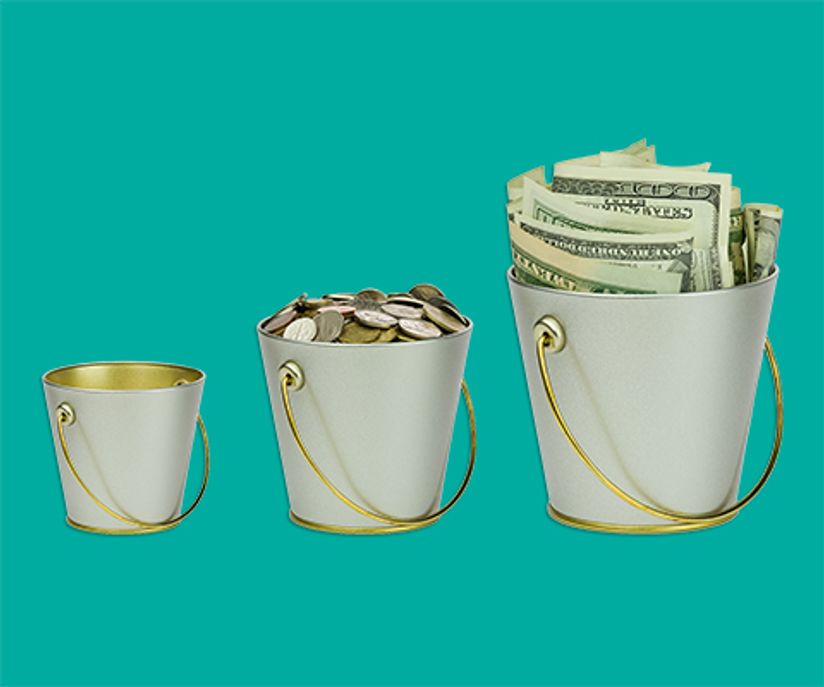 three buckets of different sizes with money in them