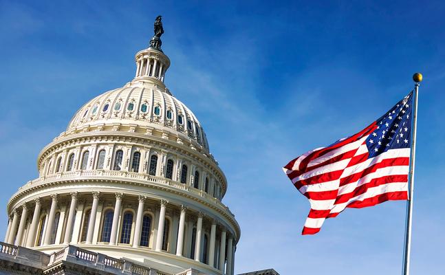 American flag waving on Capitol Hill. 