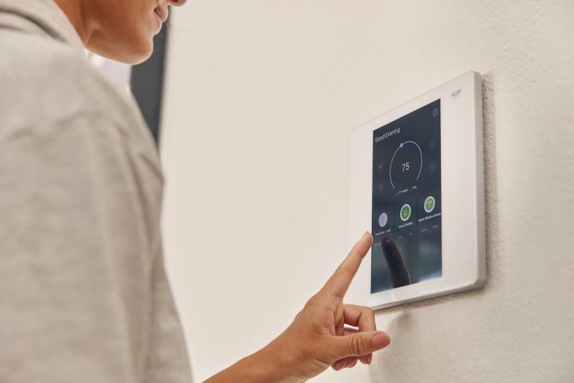 Apartment resident uses smart home device